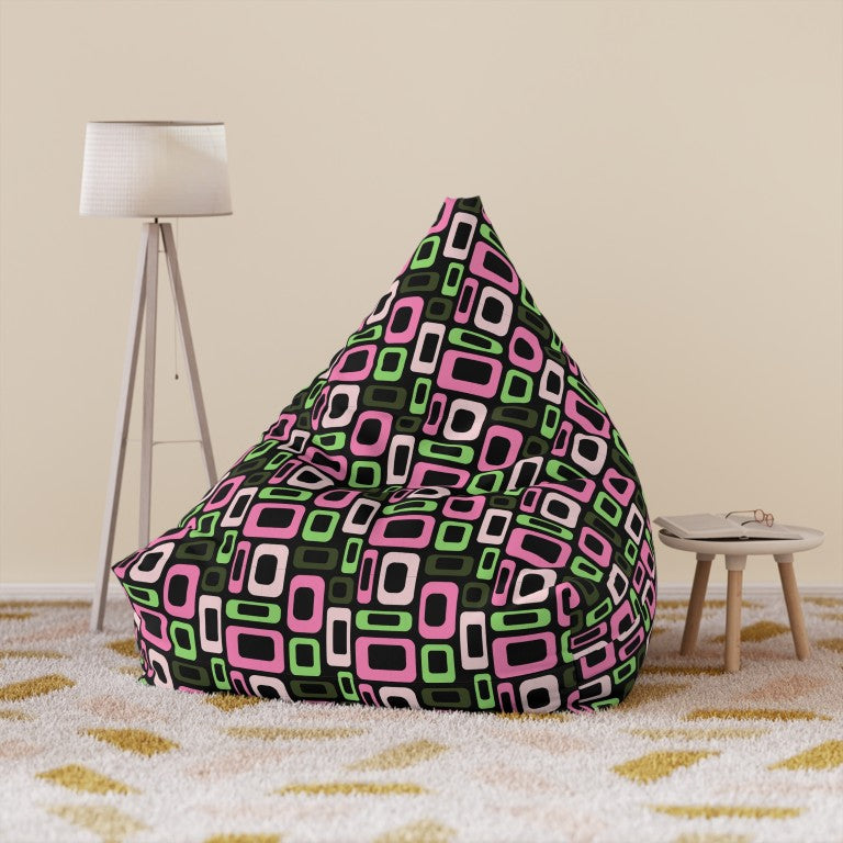 Geometric lounger cover in pop art pink and green shapes on black